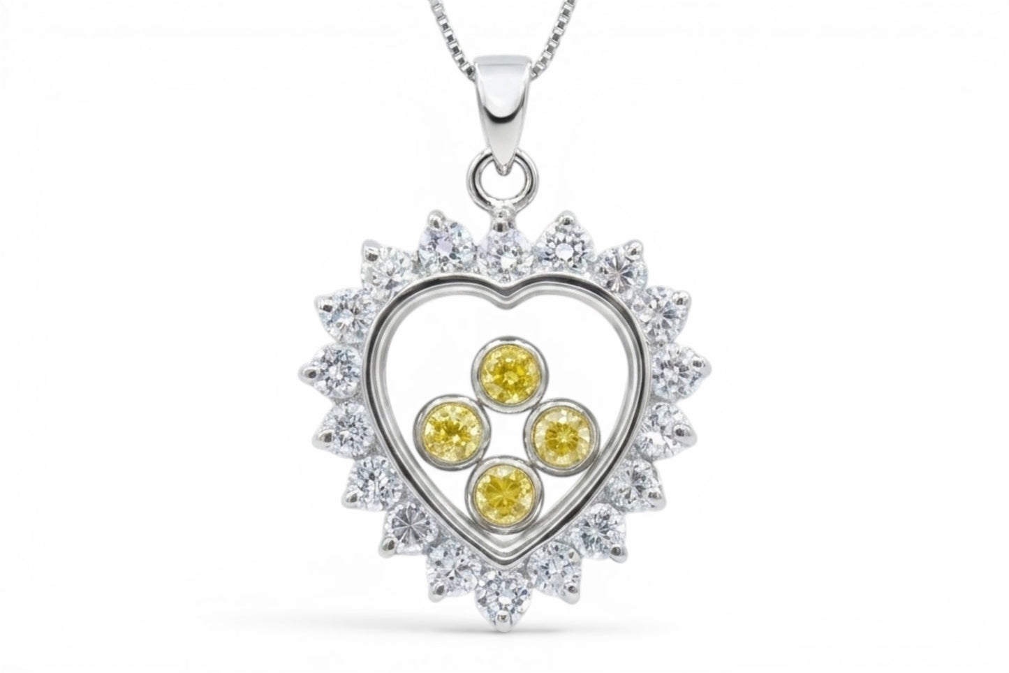 Sunshine - Pendentif en forme de cœur en argent sterling avec bordure en zircone cubique transparent et zircones cubiques flottantes jaunes sur une chaîne en argent sterling